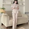 Bộ pijama dài màu be chữ newpost